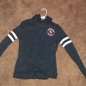 This shirt is navy blue form Abercrombie and kids.